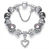 Pulsera con charms plateados y cristal rosa y corazón