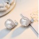 Pendientes elegantes con perla blanca grande y microcristales