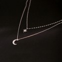 Collar minimalista doble en plata con colgantes de estrella y luna