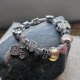 Pulsera color plateada con charms y abalorios