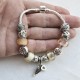 Pulsera con charms cristal rosa y blanco y colgante con ala y corazon