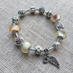 Bracelet with Pink and White Crystal Charms and a Wing and Heart Pendant